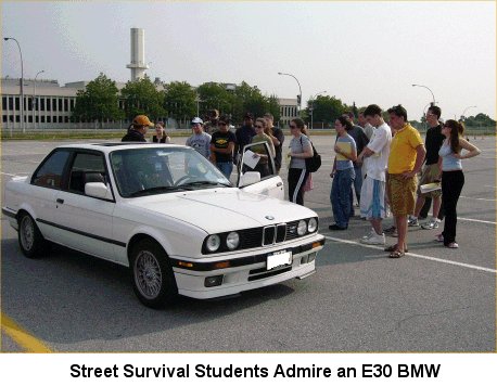 [Street Survival Students Admire an E30 BMW]